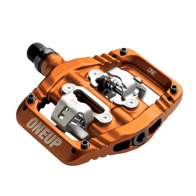 Pedal OneUp Clip naranja para MTB, plataforma amplia, ajuste de tensión y compatible con SPD